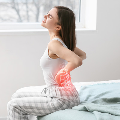 what causes lower back pain in females
